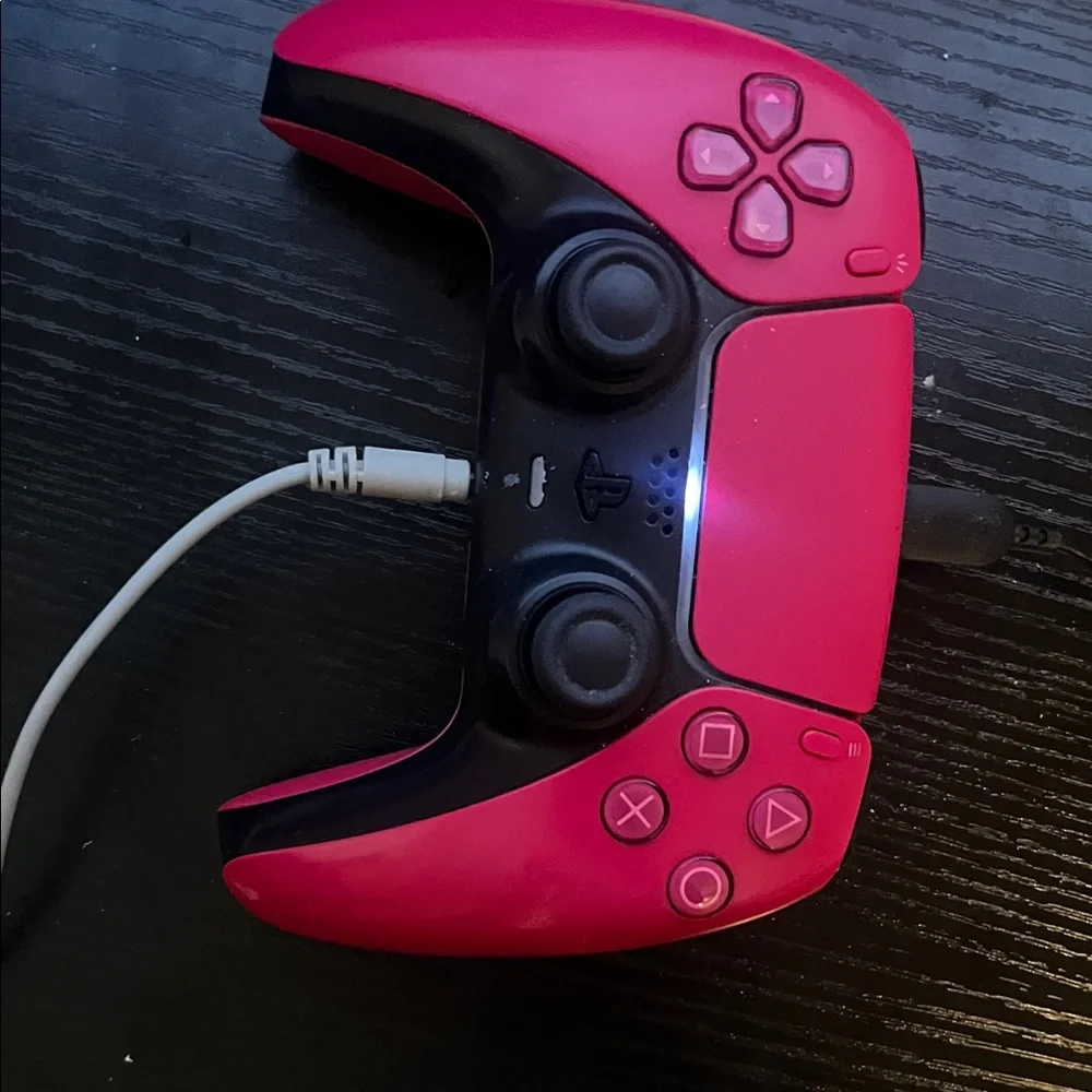 PS5 with controller and headset.